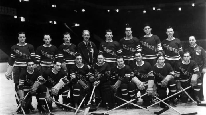 NEW YORK, NY – 1938: The New York Rangers pose for the team portrait circa 1938 at the Madison Square Garden in New York, New York. Top row: Lynn Patrick, coach Lester Patrick, Ott Heller, Muzz Patrick, Babe Pratt, Alex Shibicky and trainer Harry Winterly. Bottom row: Phil Watson, Art Coulter, Neil Coulville, goalie Dave Kerr and Clint Smith. (Photo by B Bennett/Getty Images)