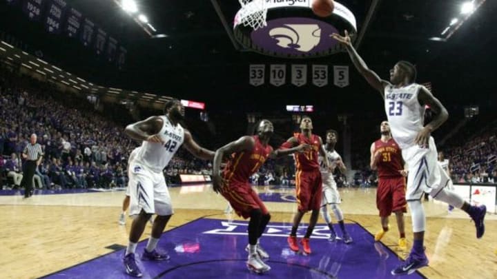 Feb 28, 2015; Manhattan, KS, USA; Kansas State Wildcats guard Nigel Johnson (23) shoots the ball in front of Iowa State Cyclones forward Jameel McKay (1), guard Monte Morris (11), and forward Georges Niang (31) during the Wildcats