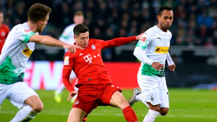 Raffael, Borussia Monchengladbach and Robert Lewandowski, Bayern Munich. (Photo by UWE KRAFT/AFP via Getty Images)
