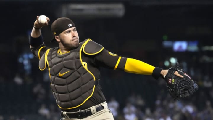 Aug 15, 2021; Phoenix, Arizona, USA; San Diego Padres catcher Victor Caratini (17) makes the play for an out against the Arizona Diamondbacks in the first inning at Chase Field. Mandatory Credit: Rick Scuteri-USA TODAY Sports