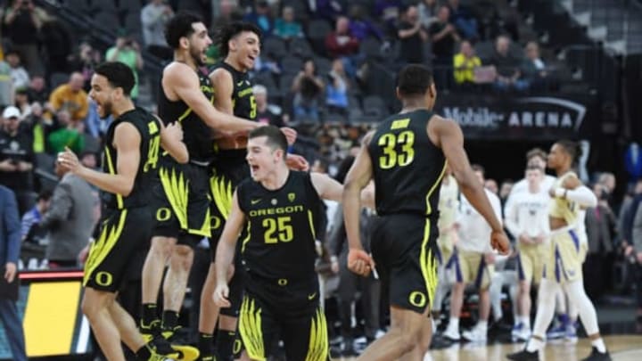 LAS VEGAS, NEVADA – MARCH 16: (L-R) Will Johnson #54, Ehab Amin #4, Miles Norris #5, Luke Osborn #25 and Francis Okoro #33 of the Oregon Ducks celebrate as time expires in their 68-48 victory over the Washington Huskies to win the championship game of the Pac-12 basketball tournament at T-Mobile Arena on March 16, 2019 in Las Vegas, Nevada.(Photo by Ethan Miller/Getty Images)