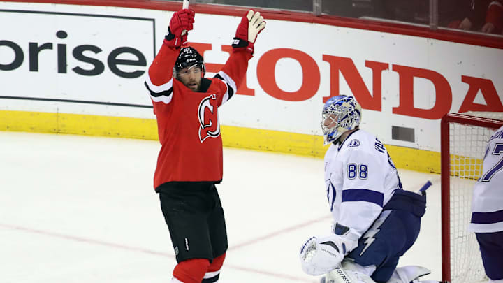 NEWARK, NJ – APRIL 18: Patrick Maroon #17 of the New Jersey Devils celebrates a first-period goal by Kyle Palmieri #21 against Andrei Vasilevskiy #88 of the Tampa Bay Lightning in Game Four of the Eastern Conference First Round during the 2018 NHL Stanley Cup Playoffs at the Prudential Center on April 18, 2018 in Newark, New Jersey. The Lightning defeated the Devils 3-1. (Photo by Bruce Bennett/Getty Images)