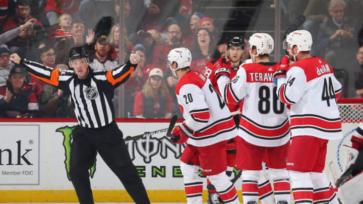 NEWARK, NJ - DECEMBER 29: Referee Jon McIsaac #45 waives off a third period goal by Teuvo Teravainen #86 of the Carolina Hurricanes during the game against the New Jersey Devils at the Prudential Center on December 29, 2018 in Newark, New Jersey. The Devils defeated the Hurricanes 2-0. (Photo by Andy Marlin/NHLI via Getty Images)