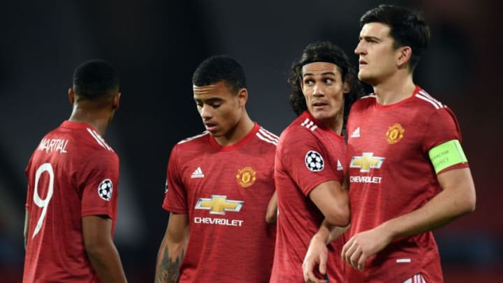 Manchester United's French striker Anthony Martial (L), Manchester United's English striker Mason Greenwood (2L), Manchester United's Uruguayan striker Edinson Cavani (2R) and Manchester United's English defender Harry Maguire prepare a defensive wall during the UEFA Champions league group H football match between Manchester United and Istanbul Basaksehir at Old Trafford stadium in Manchester, north west England, on November 24, 2020. (Photo by Oli SCARFF / AFP) (Photo by OLI SCARFF/AFP via Getty Images)