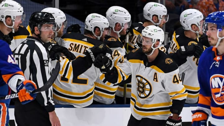 Jun 5, 2021; Uniondale, New York, USA; Boston Bruins center David Krejci (46) celebrates with the Bruins bench after scoring a goal against the New York Islanders during the second period in game four of the second round of the 2021 Stanley Cup Playoffs at Nassau Veterans Memorial Coliseum. Mandatory Credit: Dennis Schneidler-USA TODAY Sports