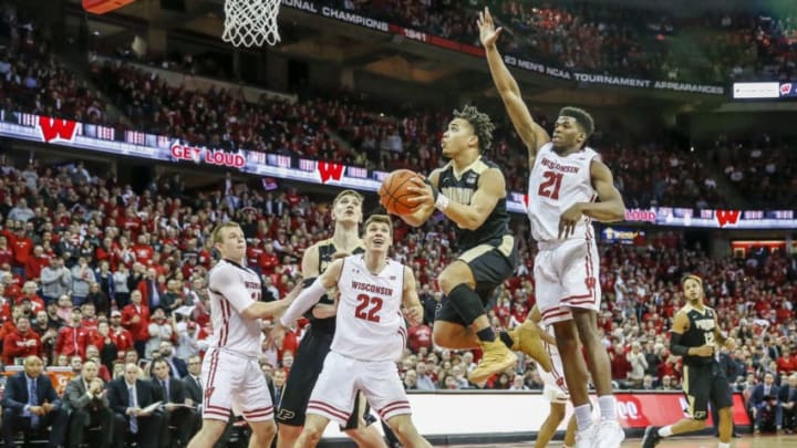 MADISON, WI - FEBRUARY 15: Wisconsin guard Khalil Iverson (21) tries to keep a flying Purdue guard Carsen Edwards (3) from scoring during a college basketball game between the University of Wisconsin Badgers and the Purdue University Boilermakers on February 15, 2018 at the Kohl Center in Madison, WI. (Photo by Lawrence Iles/Icon Sportswire via Getty Images)