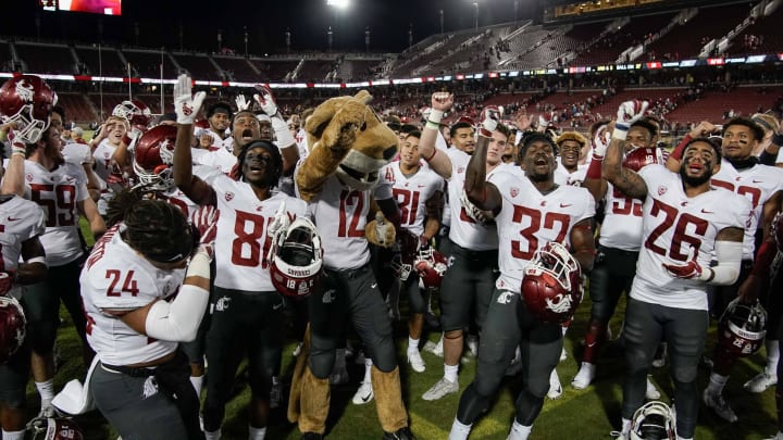 Oct 27, 2018; Stanford, CA, USA; Washington State Cougars mascot Butch T. Cougar celebrates with players after defeating the Stanford Cardinal at Stanford Stadium. Mandatory Credit: Stan Szeto-USA TODAY Sports