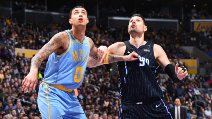 LOS ANGELES, CA - MARCH 7: Kyle Kuzma #0 of the Los Angeles Lakers fights for position against Nikola Vucevic #9 of the Orlando Magic at STAPLES Center on March 7, 2017 in Los Angeles, California. NOTE TO USER: User expressly acknowledges and agrees that, by downloading and/or using this Photograph, user is consenting to the terms and conditions of the Getty Images License Agreement. Mandatory Copyright Notice: Copyright 2017 NBAE (Photo by Andrew D. Bernstein/NBAE via Getty Images)