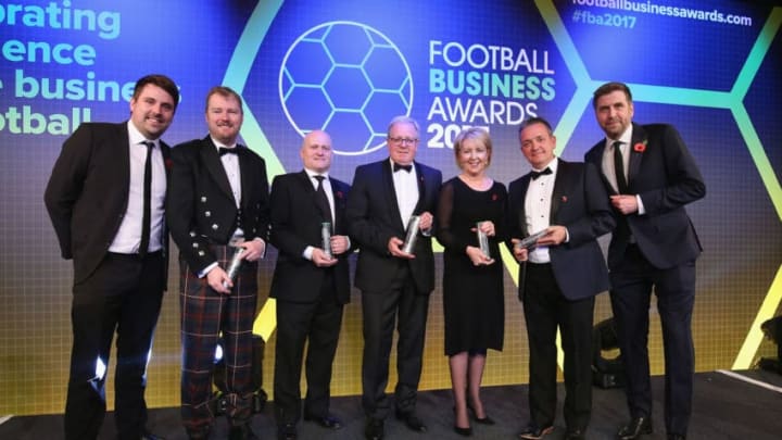 LONDON, ENGLAND - NOVEMBER 02: Neil Rowe - Head of Partnerships FC Business, Duncan Fraser - CEO of Aberdeen FC, Andy Mullen - Sheffield United FC, John Kay - CEO Preston North End FC, Donna Maria-Cullen - Tottenham Hotspur FC, Gary Sweet - Luton Town FC and host Mark Chapman pose for a photograph after the presentation of the FC Business CEO of the Year award for the individual UK leagues during the Football Business Awards evening at Tobacco Dock on November 2, 2017 in London, England. (Photo by Alex Morton/Getty Images for Football Business Awards )