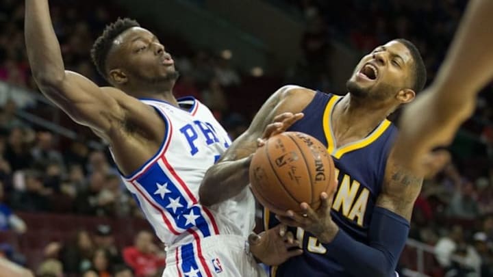 Apr 2, 2016; Philadelphia, PA, USA; Indiana Pacers forward Paul George (13) reacts while being fouled by Philadelphia 76ers forward Jerami Grant (39) during the first quarter at Wells Fargo Center. Mandatory Credit: Bill Streicher-USA TODAY Sports
