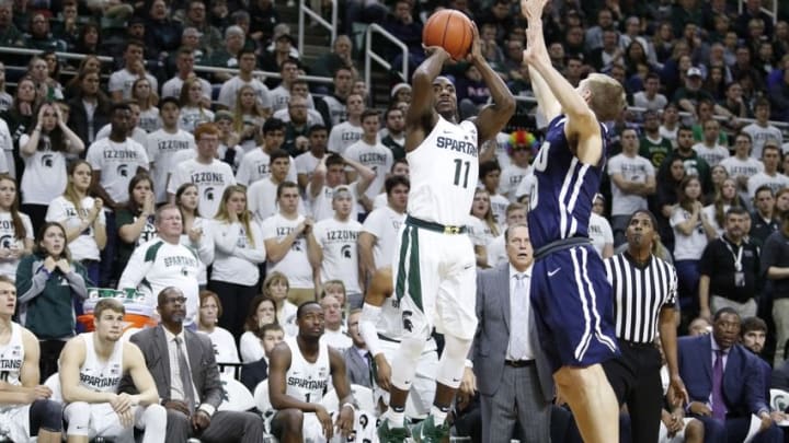 Dec 3, 2016; East Lansing, MI, USA; Michigan State Spartans guard Lourawls Nairn Jr. (11) takes a shot over Oral Roberts Golden Eagles guard Jalen Bradley (10) during the second half at Jack Breslin Student Events Center. Spartans win 80-76. Mandatory Credit: Raj Mehta-USA TODAY Sports