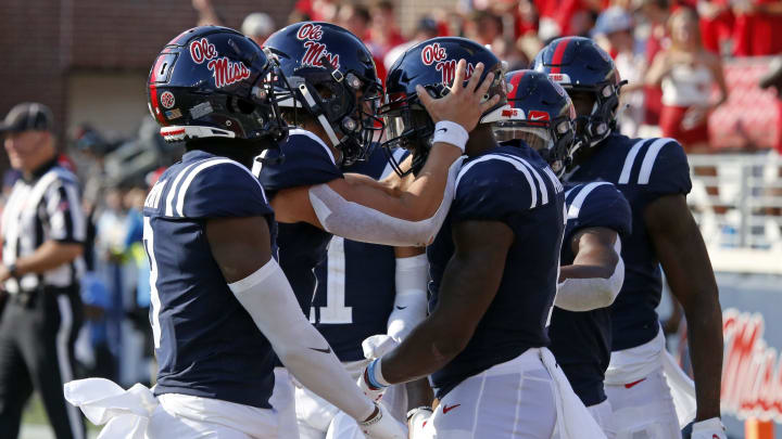 Sep 24, 2022; Oxford, Mississippi, USA; Mississippi Rebels quarterback Jaxson Dart (2) reacts with Mississippi Rebels wide receiver Jonathan Mingo (1) after a touchdown during the first half against the Tulsa Golden Hurricane at Vaught-Hemingway Stadium. Mandatory Credit: Petre Thomas-USA TODAY Sports