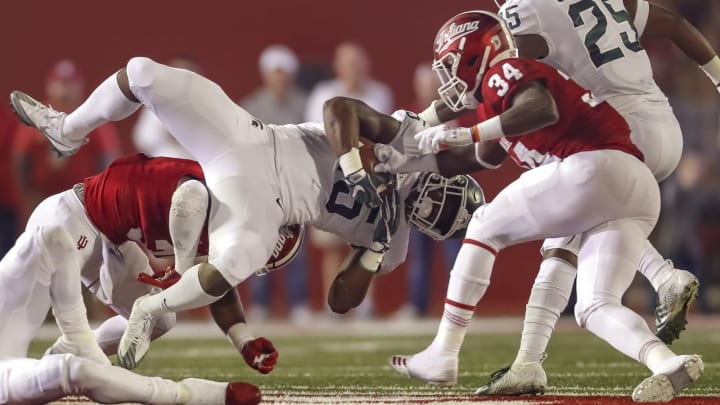 BLOOMINGTON, IN – SEPTEMBER 22: La’Darius Jefferson #15 of the Michigan State Spartans runs the ball as Cam Jones #34 of the Indiana Hoosiers punches the ball away causing a fumble during the first half of action at Memorial Stadium on September 22, 2018 in Bloomington, Indiana. (Photo by Michael Hickey/Getty Images)