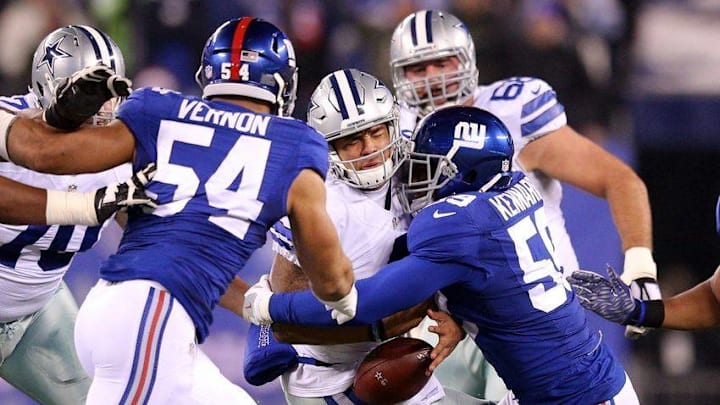 Dec 11, 2016; East Rutherford, NJ, USA; Dallas Cowboys quarterback Dak Prescott (4) fumbles after being hit by New York Giants linebacker Devon Kennard (59) during the second quarter at MetLife Stadium. Mandatory Credit: Brad Penner-USA TODAY Sports