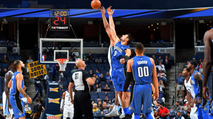 MEMPHIS, TN - OCTOBER 2: Nikola Vucevic #9 of the Orlando Magic goes for the tip off against the Memphis Grizzlies during a preseason game on October 2, 2017 at FedExForum in Memphis, Tennessee. NOTE TO USER: User expressly acknowledges and agrees that, by downloading and or using this photograph, User is consenting to the terms and conditions of the Getty Images License Agreement. Mandatory Copyright Notice: Copyright 2017 NBAE (Photo by Jesse D. Garrabrant/NBAE via Getty Images)