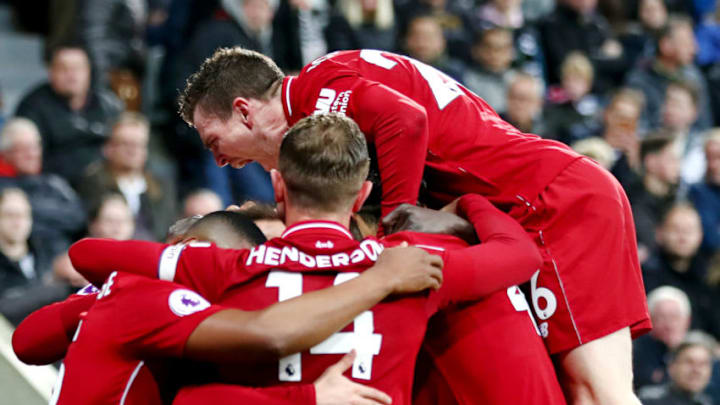 NEWCASTLE UPON TYNE, ENGLAND - MAY 04: Divock Origi of Liverpool celebrates with teammates after scoring his team's third goal during the Premier League match between Newcastle United and Liverpool FC at St. James Park on May 04, 2019 in Newcastle upon Tyne, United Kingdom. (Photo by Clive Brunskill/Getty Images)