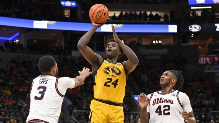Dec 22, 2022; St. Louis, Missouri, USA; Missouri Tigers guard Kobe Brown (24) shoots against Illinois Fighting Illini guard Jayden Epps (3) and forward Dain Dainja (42) during the first half at Enterprise Center. Mandatory Credit: Jeff Curry-USA TODAY Sports