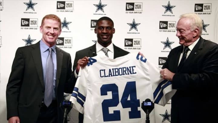 Apr 27, 2012; Valley Ranch, TX, USA; From left Dallas Cowboys head coach Jason Garrett and first round draft pick Morris Claiborne and owner Jerry Jones pose with a jersey at a press conference at Dallas Cowboys Headquarters. Mandatory Credit: Tim Heitman-USA TODAY Sports