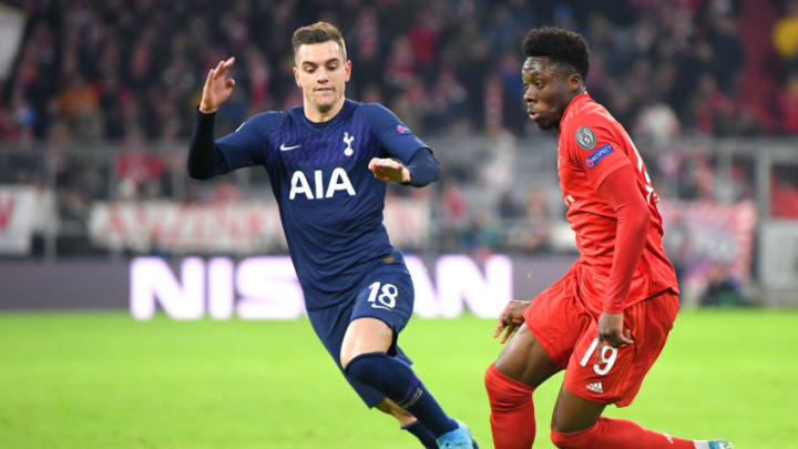 MUNICH, GERMANY - DECEMBER 11: Alphonso Davies of FC Bayern Munich runs with the ball under pressure from Giovani Lo Celso of Tottenham Hotspur during the UEFA Champions League group B match between Bayern Muenchen and Tottenham Hotspur at Allianz Arena on December 11, 2019 in Munich, Germany. (Photo by Michael Regan/Getty Images)