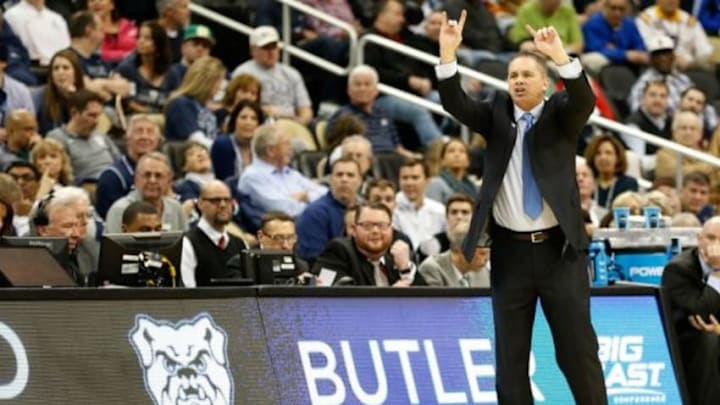 Mar 19, 2015; Pittsburgh, PA, USA; Butler Bulldogs head coach Chris Holtmann signals from the bench against the Texas Longhorns in the second round of the 2015 NCAA Tournament at Consol Energy Center. Mandatory Credit: Geoff Burke-USA TODAY Sports Mar 19, 2015; Pittsburgh, PA, USA; Butler Bulldogs head coach Chris Holtmann signals from the bench against the Texas Longhorns in the second round of the 2015 NCAA Tournament at Consol Energy Center. Mandatory Credit: Geoff Burke-USA TODAY Sports