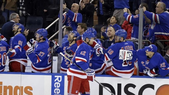 Mar 27, 2016; New York, NY, USA; New York Rangers center Eric Staal (12) celebrates scoring a goal with teammate and brother Marc Staal (18) against the Pittsburgh Penguins during the first period at Madison Square Garden. Mandatory Credit: Adam Hunger-USA TODAY Sports