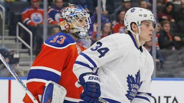 Nov 29, 2016; Edmonton, Alberta, CAN; Toronto Maple Leafs forward Auston Matthews (34) tries to screen Edmonton Oilers goaltender Cam Talbot (33) during the second period at Rogers Place. Mandatory Credit: Perry Nelson-USA TODAY Sports