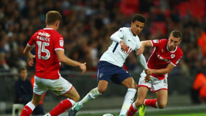 LONDON, ENGLAND – SEPTEMBER 19: Dele Alli of Tottenham Hotspur and Joe Williams of Barnsley battle for possession during the Carabao Cup Third Round match between Tottenham Hotspur and Barnsley at Wembley Stadium on September 19, 2017 in London, England. (Photo by Clive Rose/Getty Images)