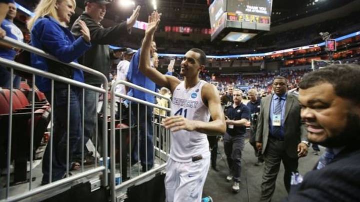Mar 21, 2015; Louisville, KY, USA; Kentucky Wildcats forward Trey Lyles (41) high fives fans after the game against the Cincinnati Bearcats in the third round of the 2015 NCAA Tournament at KFC Yum! Center. Kentucky wins 64-51. Mandatory Credit: Brian Spurlock-USA TODAY Sports