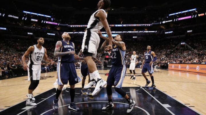 Apr 19, 2016; San Antonio, TX, USA; San Antonio Spurs small forward Kawhi Leonard (2, top) dunks the ball against the Memphis Grizzlies in game two of the first round of the NBA Playoffs at AT&T Center. Mandatory Credit: Soobum Im-USA TODAY Sports