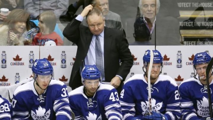 Jan 18, 2014; Toronto, Ontario, CAN; Toronto Maple Leafs head coach Randy Carlyle looks on from the bench against the Montreal Canadiens at Air Canada Centre. Mandatory Credit: Tom Szczerbowski-USA TODAY Sports