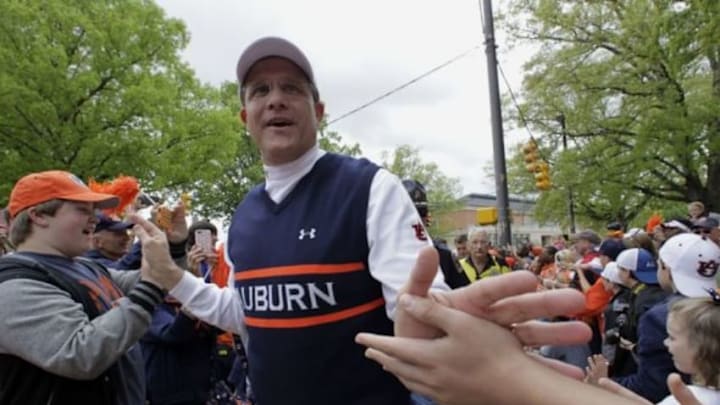 Apr 19, 2014; Auburn, AL, USA; Auburn Tigers head coach Gus Malzahn leads the team through Tiger Walk prior to the start of the A-Day spring game at Jordan Hare Stadium. Mandatory Credit: John Reed-USA TODAY Sports