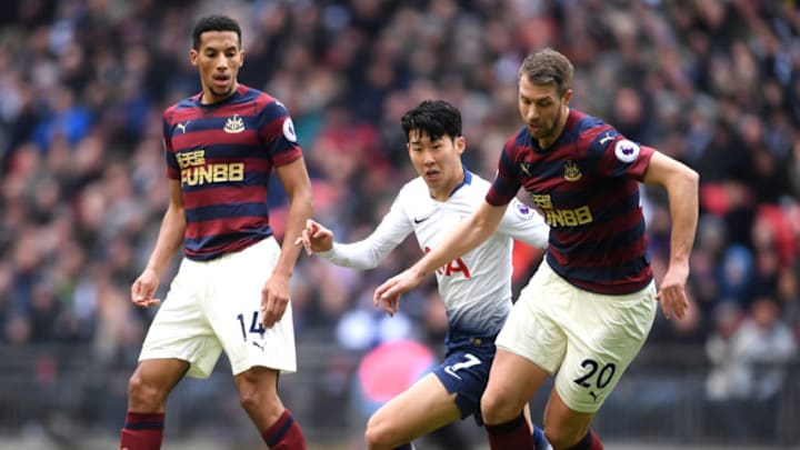 LONDON, ENGLAND - FEBRUARY 02: Florian Lejeune of Newcastle United is challenged by Heung-Min Son of Tottenham Hotspur during the Premier League match between Tottenham Hotspur and Newcastle United at Wembley Stadium on February 2, 2019 in London, United Kingdom. (Photo by Laurence Griffiths/Getty Images)