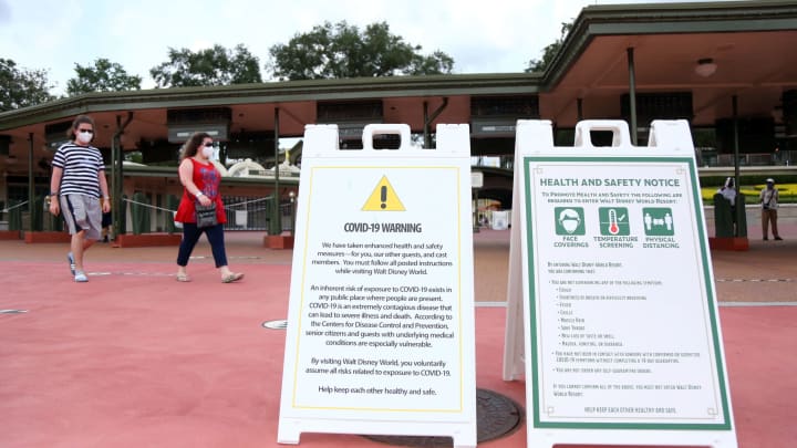 Aug 28, 2020; Orlando, Florida, USA; Covid-19 warning and health and safety notices are located at the entrance of Magic Kingdom. Governor Ron DeSantis States Florida Government is ÒComfortableÓ with Expanding Theme Park Capacity. Mandatory Credit: Kim Klement-USA TODAY NETWORK