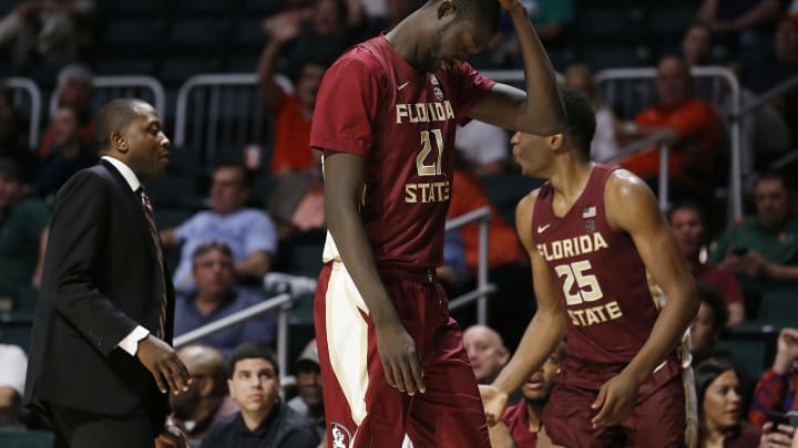 MIAMI, FLORIDA – JANUARY 27: Christ Koumadje #21 of the Florida State Seminoles reacts after being ejected for a flagrant 2 foul against the Miami Hurricanes during the second half at Watsco Center on January 27, 2019 in Miami, Florida. (Photo by Michael Reaves/Getty Images)