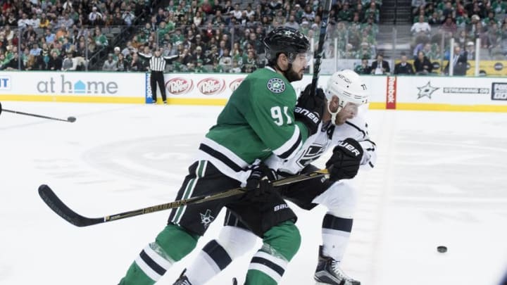 Dec 23, 2016; Dallas, TX, USA; Dallas Stars center Tyler Seguin (91) and Los Angeles Kings center Jeff Carter (77) fight for the puck during the third period at the American Airlines Center. The Stars defeat the Kings 3-2 in overtime. Mandatory Credit: Jerome Miron-USA TODAY Sports
