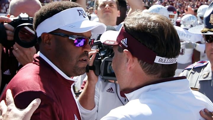 Oct 4, 2014; Starkville, MS, USA; Texas A&M Aggies head coach Kevin Sumlin (left) and Mississippi State Bulldogs head coach Dan Mullen meet after the game at Davis Wade Stadium. The Bulldogs defeated the Aggies 48-31. Mandatory Credit: Marvin Gentry-USA TODAY Sports