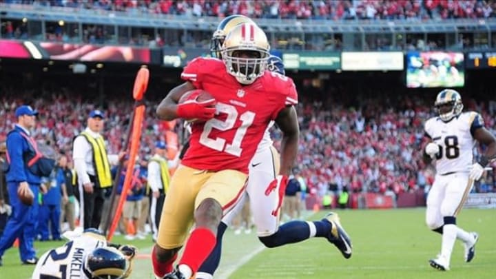 November 11, 2012; San Francisco, CA, USA; San Francisco 49ers running back Frank Gore (21) scores a touchdown against the St. Louis Rams during the fourth quarter at Candlestick Park. The 49ers and the Rams tied 24-24. Mandatory Credit: Kyle Terada-US PRESSWIRE