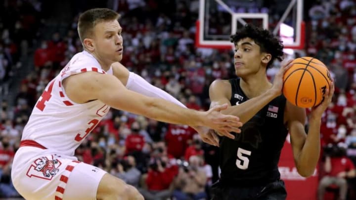 Wisconsin guard Brad Davison (34) pressures Michigan State guard Max Christie (5) during the first half of their game at the Kohl Center Friday, January 21, 2022 in Madison, Wis. Michigan State beat Wisconsin 86-74.Uwmen22 14