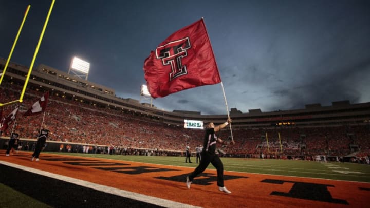 STILLWATER, OK - SEPTEMBER 25: The Texas Tech Red Raiders cheerleaders celebrate after a touchdown against the Oklahoma State Cowboys September 25, 2014 at Boone Pickens Stadium in Stillwater, Oklahoma. The Cowboys defeated the Red Raiders 45-35. (Photo by Brett Deering/Getty Images)