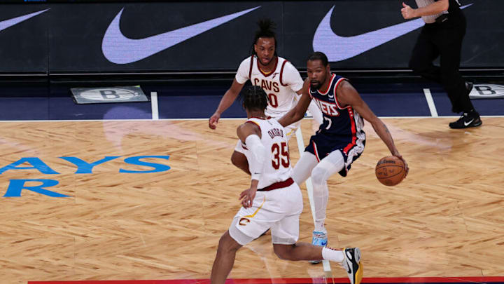 NEW YORK, NY - APRIL 8: Kevin Durant of Brooklyn Nets and Isaac Okoro, Darius Garland of Cleveland Cavaliers in action during NBA match between Brooklyn Nets and Cleveland Cavaliers at the Barclays Center in Brooklyn of New York City, United States on April 8, 2022. (Photo by Tayfun Coskun/Anadolu Agency via Getty Images)
