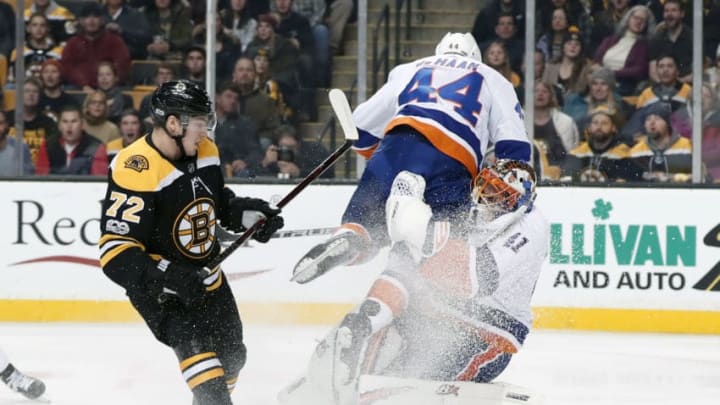 BOSTON, MA – DECEMBER 09: New York Islanders defenseman Calvin De Haan (44) colllides with Boston Bruins forward Teddy Purcell (41) as Boston Bruins center Frank Vatrano (72) looks for the puck during a game between the Boston Bruins and the New York Islanders on December 9, 2017, at TD Garden in Boston, Massachusetts, The Bruins defeated the Islanders 3-1. (Photo by Fred Kfoury III/Icon Sportswire via Getty Images)