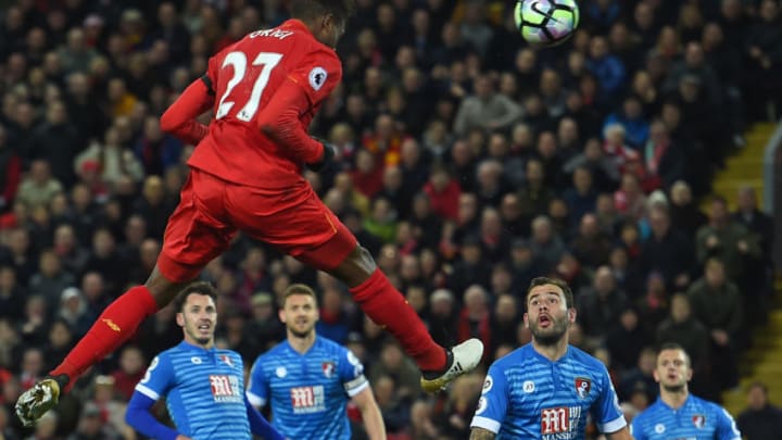 Liverpool's Belgian striker Divock Origi jumps to head their second goal during the English Premier League football match between Liverpool and Bournemouth at Anfield in Liverpool, north west England on April 5, 2017. / AFP PHOTO / PAUL ELLIS / RESTRICTED TO EDITORIAL USE. No use with unauthorized audio, video, data, fixture lists, club/league logos or 'live' services. Online in-match use limited to 75 images, no video emulation. No use in betting, games or single club/league/player publications. / (Photo credit should read PAUL ELLIS/AFP/Getty Images)