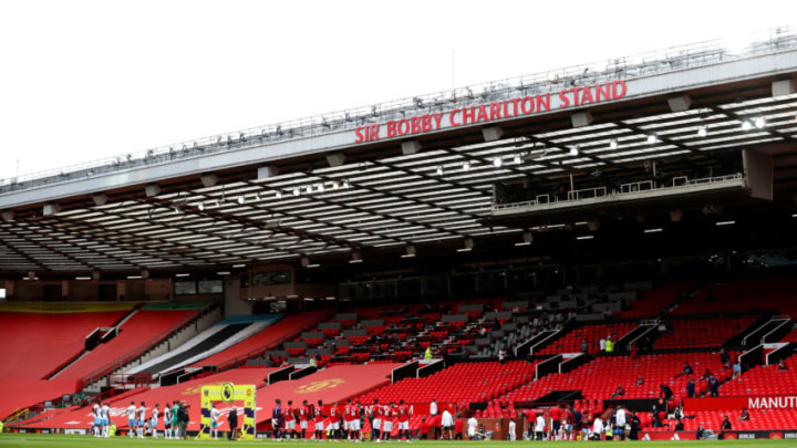 MANCHESTER, ENGLAND - JULY 22: Players of both teams line up on the pitch prior to the Premier League match between Manchester United and West Ham United at Old Trafford on July 22, 2020 in Manchester, England. Football Stadiums around Europe remain empty due to the Coronavirus Pandemic as Government social distancing laws prohibit fans inside venues resulting in all fixtures being played behind closed doors. (Photo by Catherine Ivill/Getty Images)