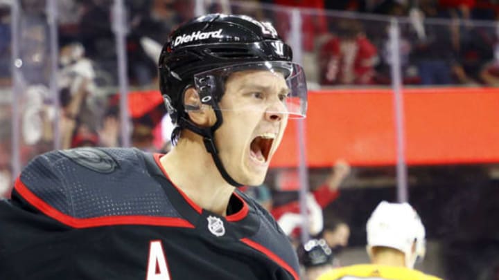 RALEIGH, NORTH CAROLINA – MAY 19: Sebastian Aho #20 of the Carolina Hurricanes celebrates following a goal scored during the first period in Game Two of the First Round of the 2021 Stanley Cup Playoffs against the Nashville Predators at PNC Arena on May 19, 2021, in Raleigh, North Carolina. (Photo by Jared C. Tilton/Getty Images)