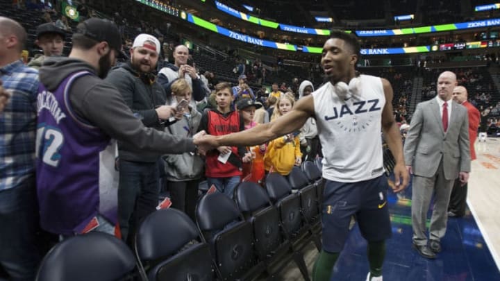 SALT LAKE CITY, UT - DECEMBER 25: Donovan Mitchell #45 of the Utah Jazz shakes hands with a fan during warmups before their game against the Portland Trail Blazers at the Vivint Smart Home Arena on December 25, 2018 in Salt Lake City , Utah. NOTE TO USER: User expressly acknowledges and agrees that, by downloading and or using this photograph, User is consenting to the terms and conditions of the Getty Images License Agreement. (Photo by Chris Gardner/Getty Images)
