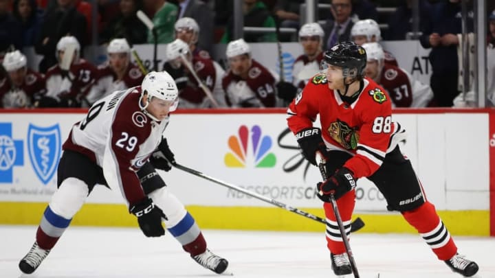 CHICAGO, IL - MARCH 06: Patrick Kane #88 of the Chicago Blackhawks looks to pass under pressure from Nathan MacKinnon #29 of the Colorado Avalanche at the United Center on March 6, 2018 in Chicago, Illinois. (Photo by Jonathan Daniel/Getty Images)
