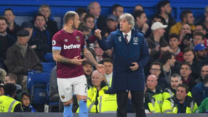 LONDON, ENGLAND - APRIL 08: Manuel Pellegrini, Manager of West Ham United and Marko Arnautovic of West Ham United in discussion during the Premier League match between Chelsea FC and West Ham United at Stamford Bridge on April 08, 2019 in London, United Kingdom. (Photo by Mike Hewitt/Getty Images)