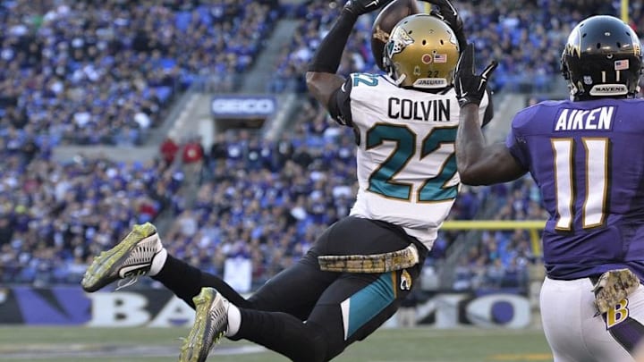 Nov 15, 2015; Baltimore, MD, USA; Jacksonville Jaguars cornerback Aaron Colvin (22) breaks up a two point conversation attempt to Baltimore Ravens wide receiver Kamar Aiken (11) during the fourth quarterat M&T Bank Stadium. Mandatory Credit: Tommy Gilligan-USA TODAY Sports
