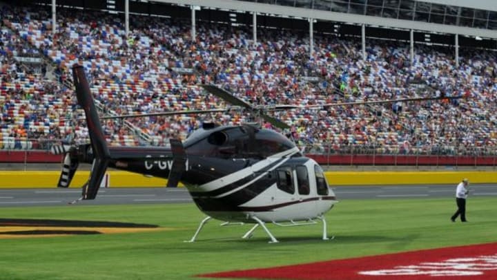 May 25, 2014; Concord, NC, USA; NASCAR Sprint Cup Series driver Kurt Busch (41) arrives by helicopter at the Coca-Cola 600 at Charlotte Motor Speedway after competing in the Indianapolis 500. Mandatory Credit: Randy Sartin-USA TODAY Sports