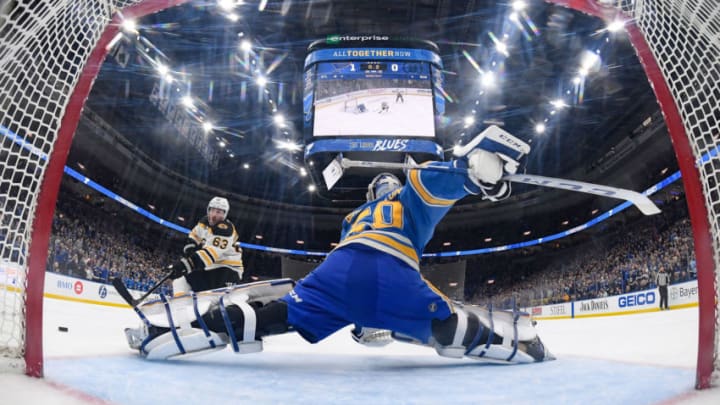 ST. LOUIS, MO - FEBRUARY 23: Jordan Binnington #50 of the St. Louis Blues defends the net against Brad Marchand #63 of the Boston Bruins at Enterprise Center on February 23, 2019 in St. Louis, Missouri. (Photo by Scott Rovak/NHLI via Getty Images)